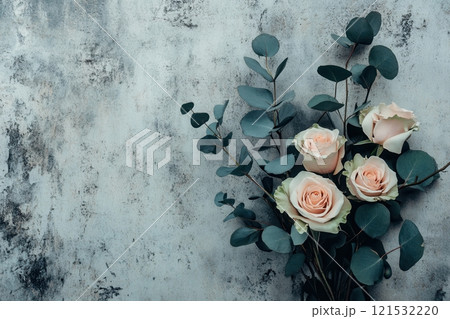 A stylish bouquet showcases soft pink roses surrounded by lush eucalyptus leaves against a textured concrete backdrop. Generative AI 121532220