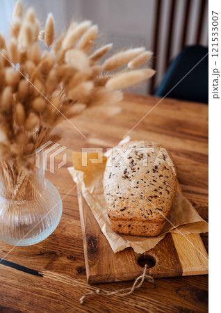 Homemade banana bread on wooden table 121533007