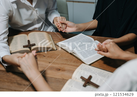 People reading and study bible in home and pray together.Studying the Word Of God People reading and study bible in home and pray together.Studying the Word Of God 121534629