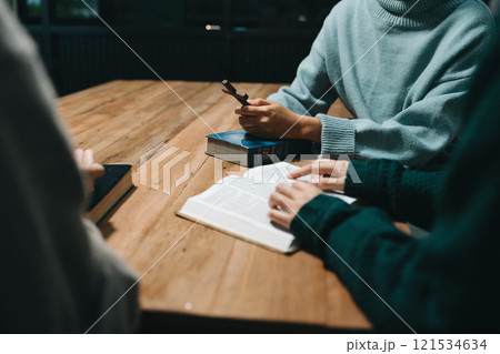 People reading and study bible in home and pray together.Studying the Word Of God People reading and study bible in home and pray together.Studying the Word Of God 121534634