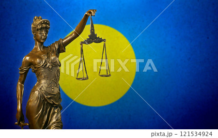 Lady Justice before a flag of Palau Lady Justice before a flag of Palau 121534924