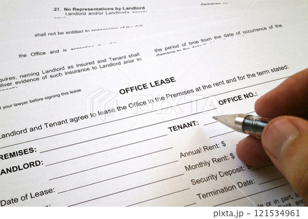 Filling an office lease form Filling an office lease form 121534961