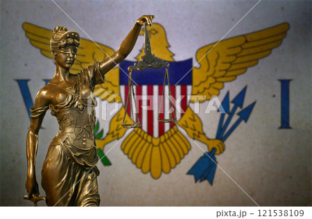 Lady Justice before a flag of the United States Virgin Islands 121538109