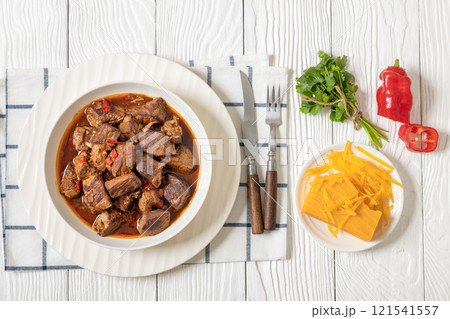 beef stew in a white bowl on rustic wooden table beef stew in a white bowl on rustic wooden table 121541557