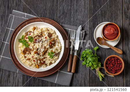 beef and rice in white bowl, top view beef and rice in white bowl, top view 121541560