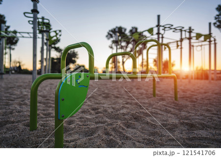 street fitness park for workout and calisthenics area, sport equipment with bars for push and pull ups, healthy lifestyle concept 121541706