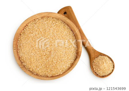 The brown sugar in wooden bowl isolated on white background. Top view. Flat lay The brown sugar in wooden bowl isolated on white background. Top view. Flat lay 121543699