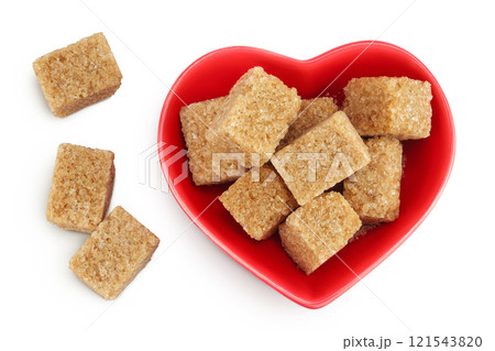 brown sugar in a ceramic bowl isolated on white background. Top view. Flat lay brown sugar in a ceramic bowl isolated on white background. Top view. Flat lay 121543820