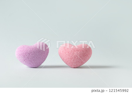 Valentine's Day two heart shaped bath salt on pastel blue background. Close up. Love concept. Banner. Valentine's Day two heart shaped bath salt on pastel blue background. Close up. Love concept. Banner. 121545992