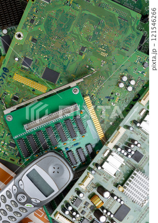 Top-Down View of Circuit Boards and Discarded Mobile Phone 121546266