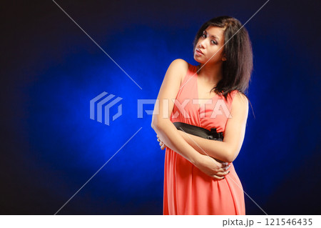 mixed race girl in party dress on blue 121546435