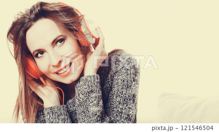 Woman with headphones listening music Woman with headphones listening music 121546504