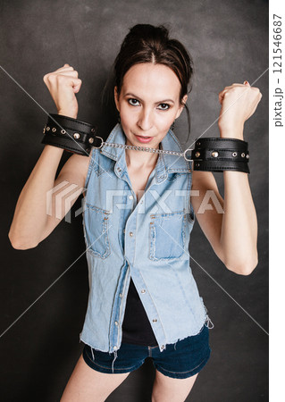 Arrest and jail. Criminal woman prisoner girl in handcuffs Arrest and jail. Criminal woman prisoner girl in handcuffs 121546687
