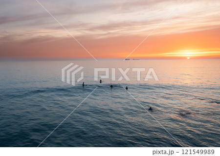 Aerial shot of silhouette people swimming in vast Aerial shot of silhouette people swimming in vast 121549989