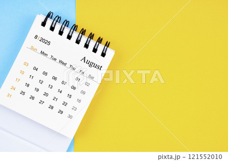 August 2025, Monthly desk calendar for 2025 year on yellow and blue background. 121552010