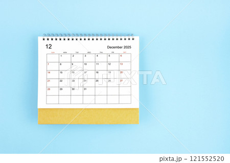 December 2025, Monthly desk calendar for 2025 year on blue background. December 2025, Monthly desk calendar for 2025 year on blue background. 121552520