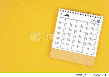 August 2025 desk calendar on yellow color background. 121552521