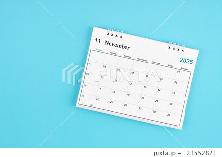 November 2025, Monthly desk calendar for 2025 year on blue background. 121552821