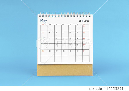May 2025, Monthly desk calendar for 2025 year on Blue background. 121552914