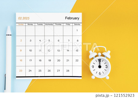 February 2025 Monthly calendar for 2025 year with pen on yellow and blue background. 121552923