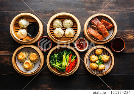 Vibrant colors and intricate textures fill the scene in a top view of a traditional Chinese meal 121554284