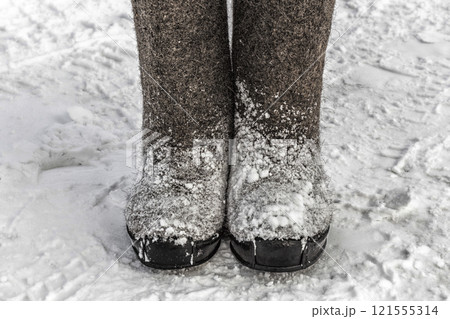 Winter felt boots in the snow 121555314