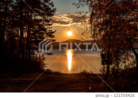 Scenic sunset on a beautiful lake in autumn Scenic sunset on a beautiful lake in autumn 121558428