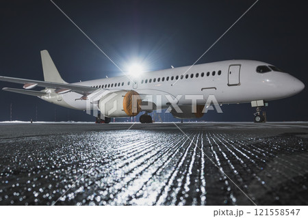 Modern passenger jet plane on the night airport apron Modern passenger jet plane on the night airport apron 121558547