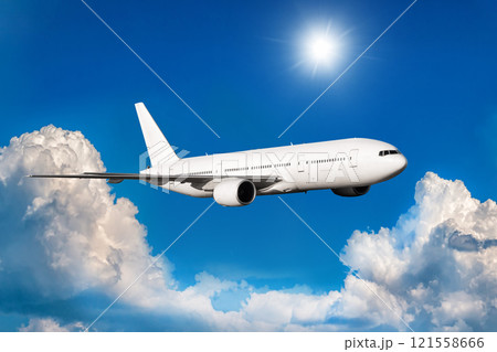 White wide body passenger airliner fly in the air above scenic clouds 121558666