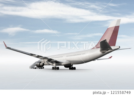 Wide body passenger jet plane with a boarding steps isolated on bright background with sky Wide body passenger jet plane with a boarding steps isolated on bright background with sky 121558749