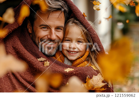 Happy beautiful autumn family cover with a maroon blanket. Happy beautiful autumn family cover with a maroon blanket. 121559062