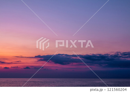 Scenic after-sunset crimson light on the sea Scenic after-sunset crimson light on the sea 121560204