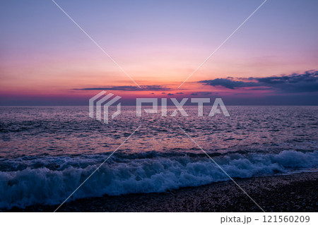 Scenic after-sunset crimson light on the sea Scenic after-sunset crimson light on the sea 121560209
