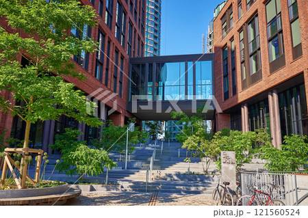 Modern red brick building with green tree in Copenhagen 121560524
