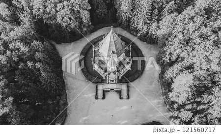 The stunning Schwarzenberg Tomb near Trebon in Czechia is surrounded by lush greenery. Its intricate architecture stands out, showcasing a serene landscape. Black and white photography. 121560717