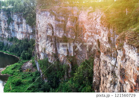 The rocky shore of a picturesque river 121560729
