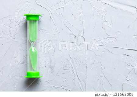 hourglass on the table, sand clock as time passing concept for business deadline, copy space 121562009