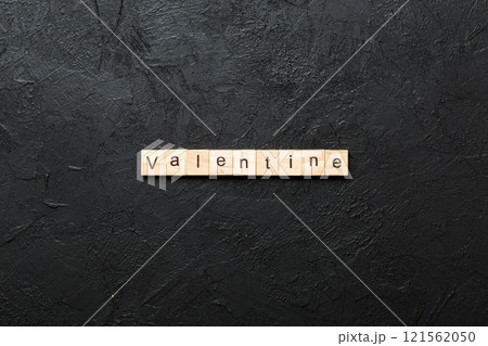 valentine word written on wood block. valentine text on table, concept 121562050