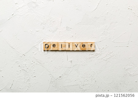 deliver word written on wood block. deliver text on table, concept 121562056
