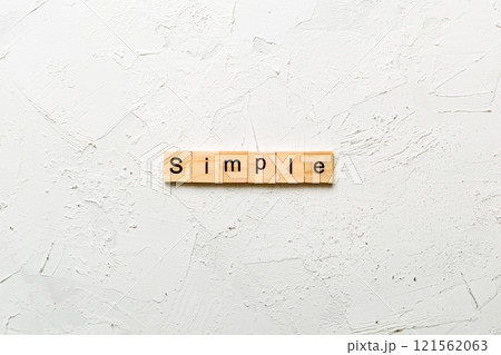 simple word written on wood block. simple text on table, concept simple word written on wood block. simple text on table, concept 121562063