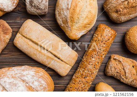 Homemade natural breads. Different kinds of fresh bread as background, top view with copy space 121562156