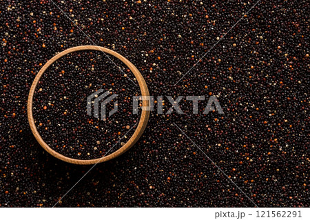 black quinoa grain in wooden bowl background and texture of gluten free top view 121562291