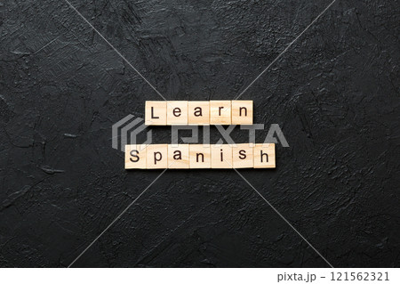 learn spanish word written on wood block. learn spanish text on table, concept learn spanish word written on wood block. learn spanish text on table, concept 121562321