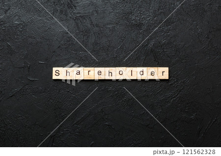 shareholder word written on wood block. shareholder text on table, concept 121562328