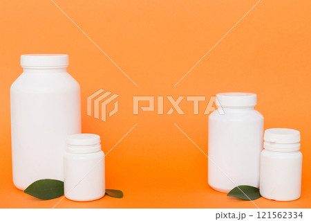 supplement pills with medicine bottle health care and medical top view. Vitamin tablets. Top view mockup bottle for pills and vitamins with green leaves, natural organic bio supplement, copy space supplement pills with medicine bottle health care and medical top view. Vitamin tablets. Top view mockup bottle for pills and vitamins with green leaves, natural organic bio supplement, copy space 121562334