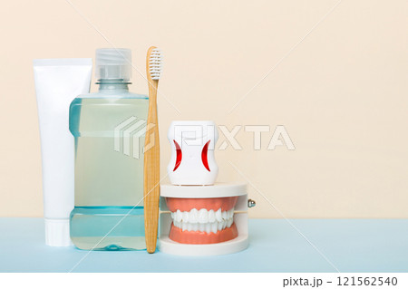 Mouthwash and other oral hygiene products on colored table top view with copy space. Flat lay. Dental hygiene. Oral care kit. Dentist concept 121562540