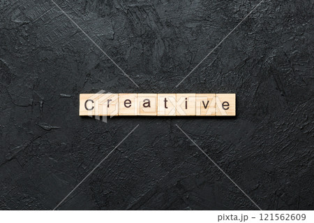 creative word written on wood block. creative text on table, concept 121562609