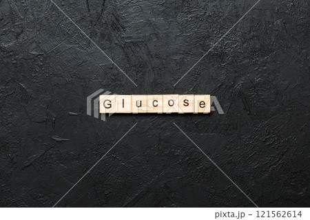 GLUCOSE word written on wood block. GLUCOSE text on cement table for your desing, concept 121562614