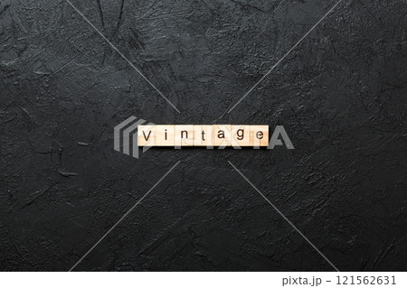 vintage word written on wood block. vintage text on cement table for your desing, concept vintage word written on wood block. vintage text on cement table for your desing, concept 121562631