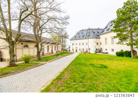 The Konigstein Fortress, a monumental structure in Saxony, Germany, showcases its impressive architecture and beautiful surroundings, inviting visitors to explore its rich history and scenic views. 121563843